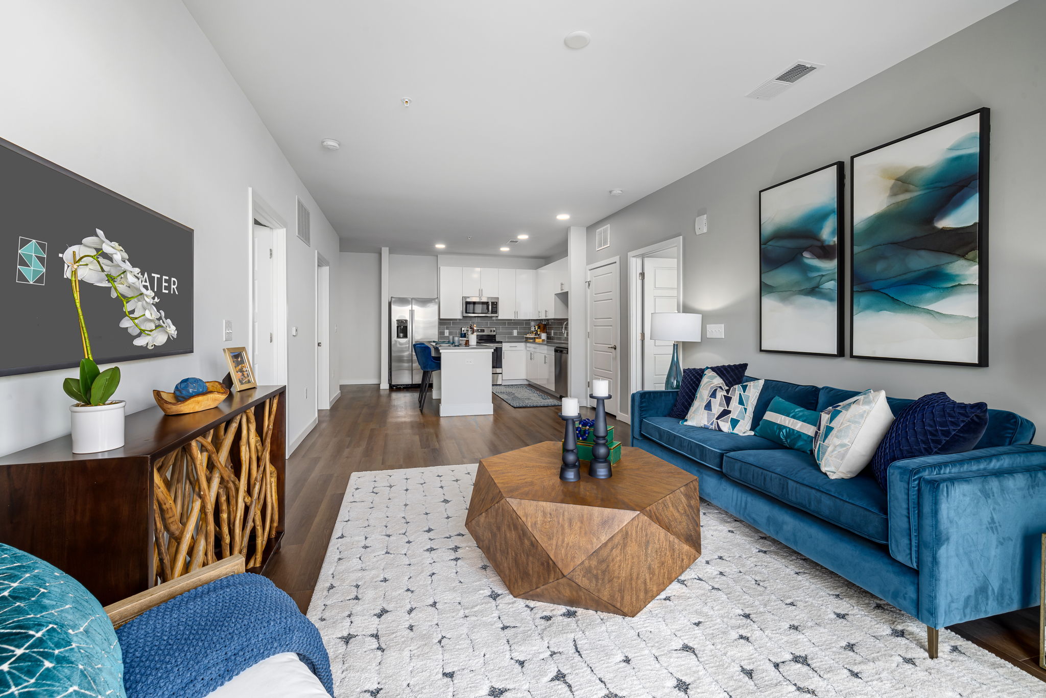 a living room with large kitchen