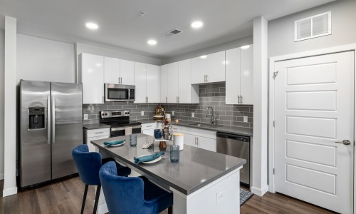 a kitchen with white cabinets